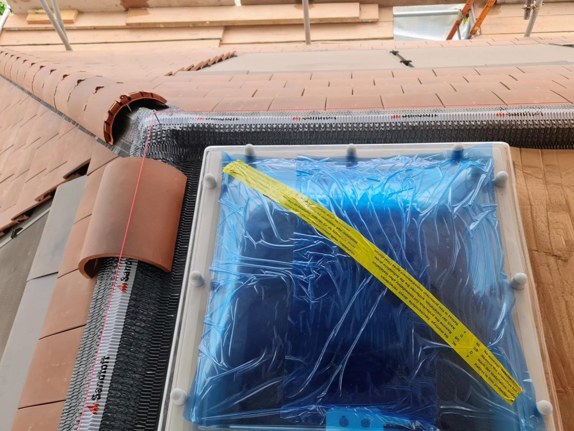 Flat roof and ridge tiles installation